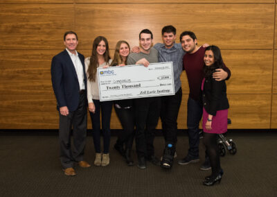 Student creators of the Companion app pose with their awards check upon winning the Pryor-Hale Award for Best Business at the 2015 Michigan Business Challenge. Companion is a peer-to-peer safety network that allows people to stay safe by keeping in touch with others while walking from one place to another.