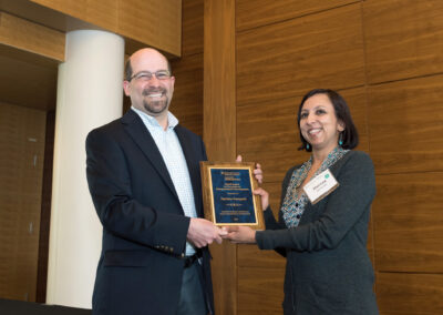 Josh Botkin presents Harinee Sampath with the Samuel Valenti Award for Exceptional Entrepreneurial Development at the 2015 Ross School of Business Entrepreneurial Luncheon. Sampaht is the founder of South Asian Flavors’ product is called Raita, a savory yogurt made with spices and vegetables suited for everything from a dip to a sauce for grilled meat and a sandwich spread. Raita is also all natural, with no added preservatives.